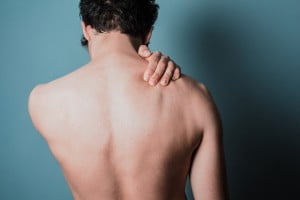 Young Indian Male Body Showing Back Pain In White, 49% OFF