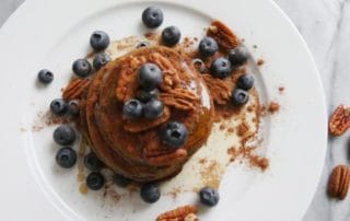 This pumpkin spice protein pancake recipe from healthy chef Lily Kunin is a Saturday morning game-changer