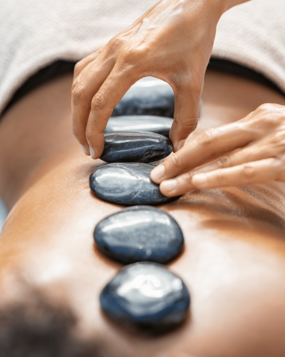 hot stone massage in pickerington person receiving hot stone massage in Pickerington, Ohio